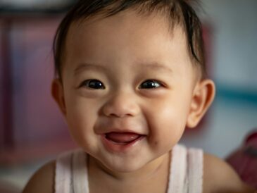 child in white tank top