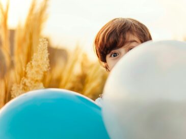 woman hiding on balloon