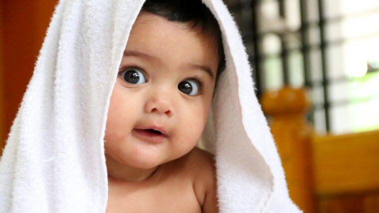 girl covered with white towel