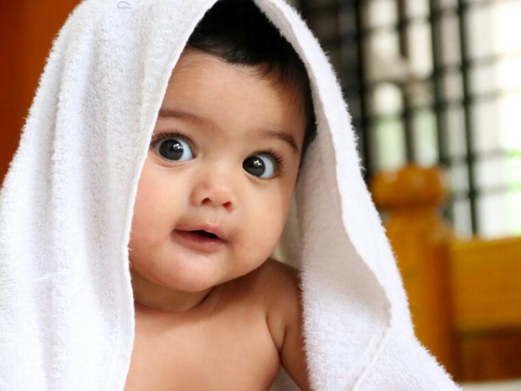 girl covered with white towel