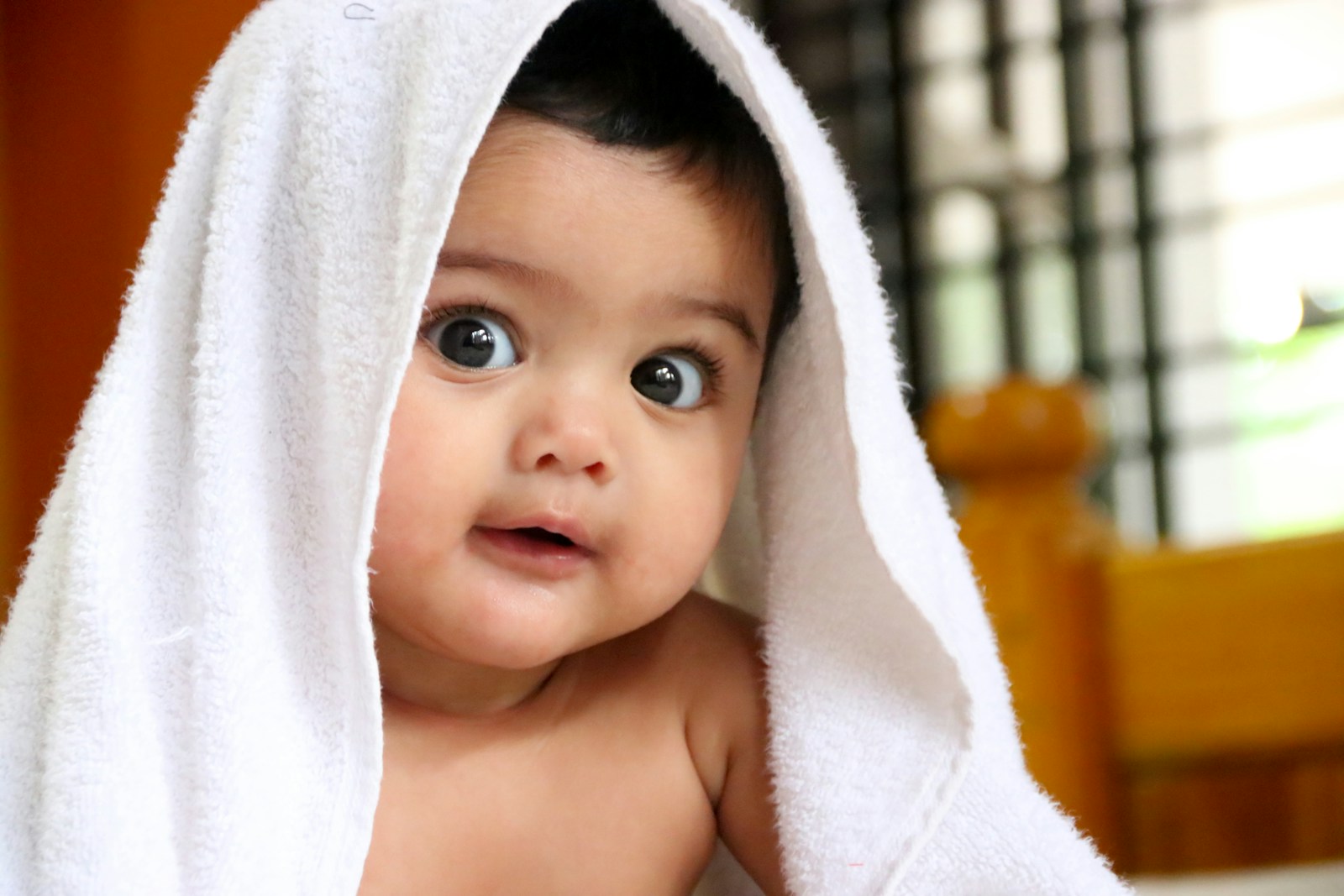 girl covered with white towel